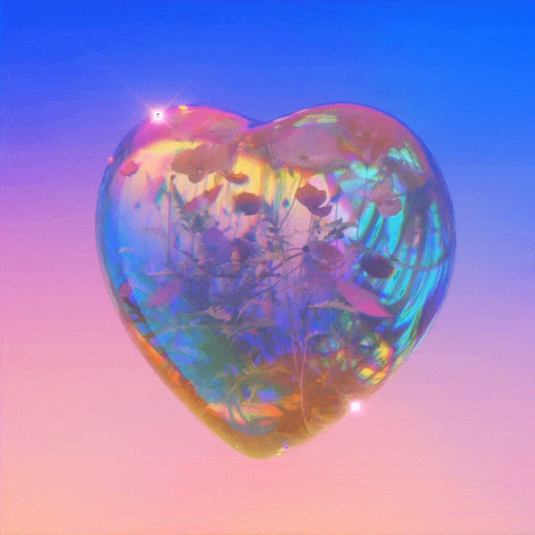 Animated iridescent glass heart blooming against a blue and pink sky